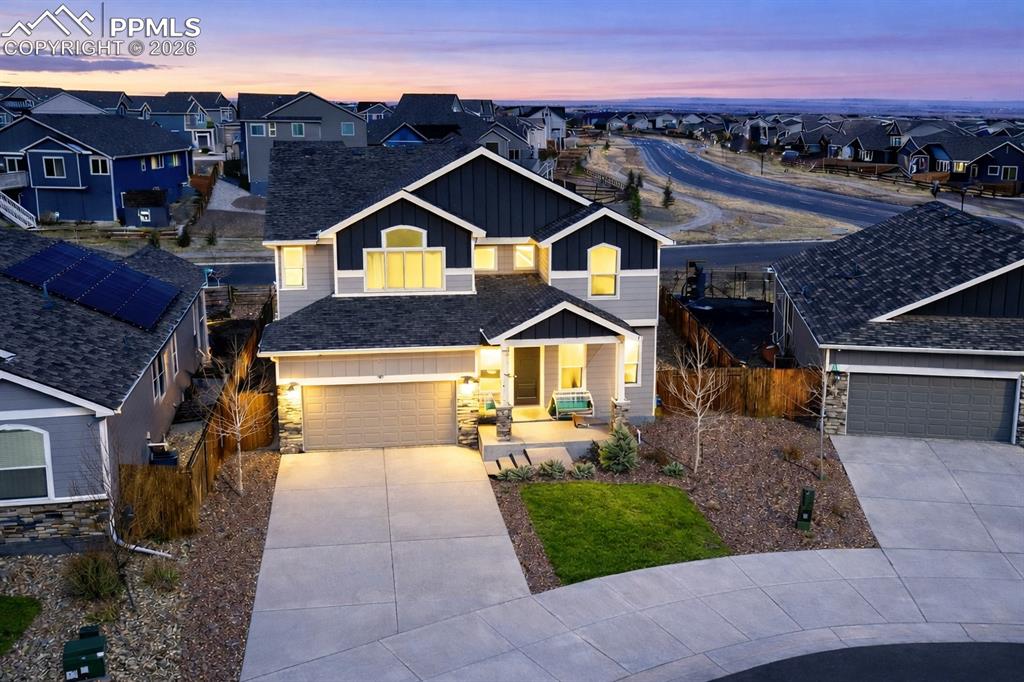 Image 2 of 40: Beautiful Colorado Craftsman home with stone accents, welcoming entry, and 