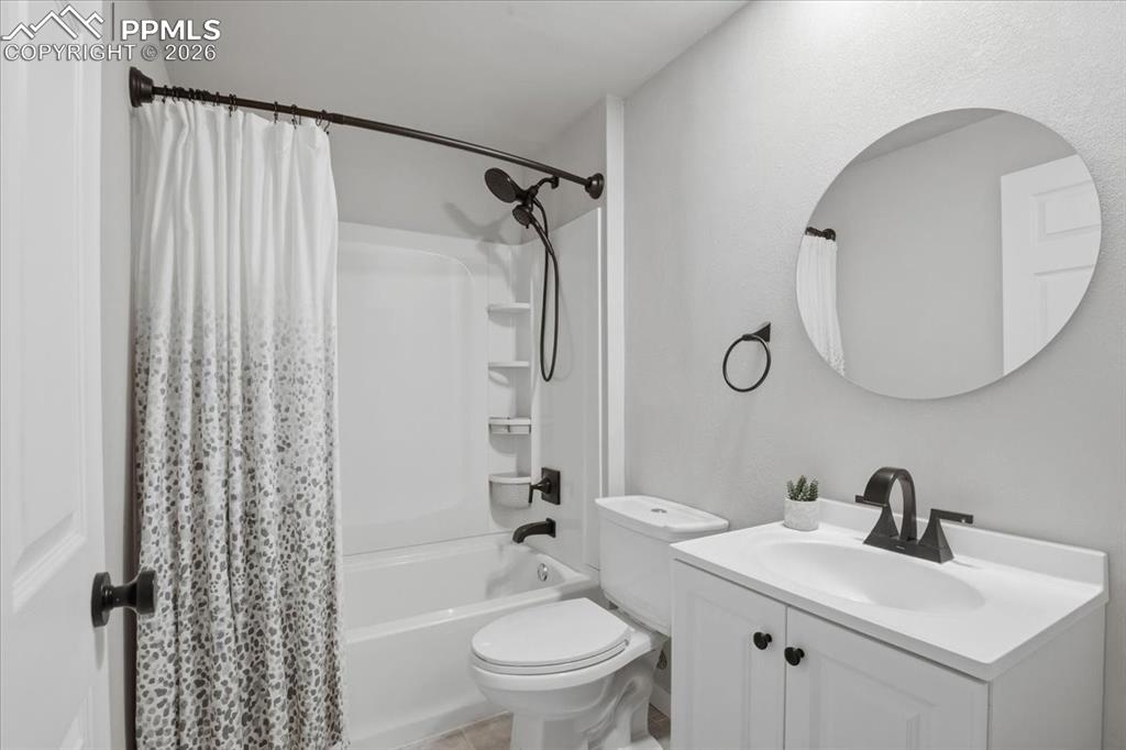 Image 31 of 40: Basement full bathroom conveniently located near the entertainment and wet 