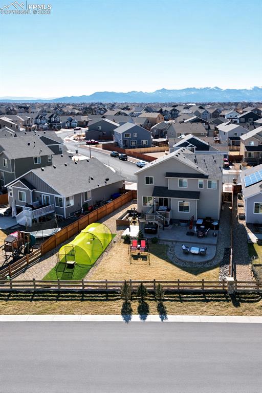 Image 34 of 40: Ariel view showcasing the fenced backyard, patio, and outdoor living spaces
