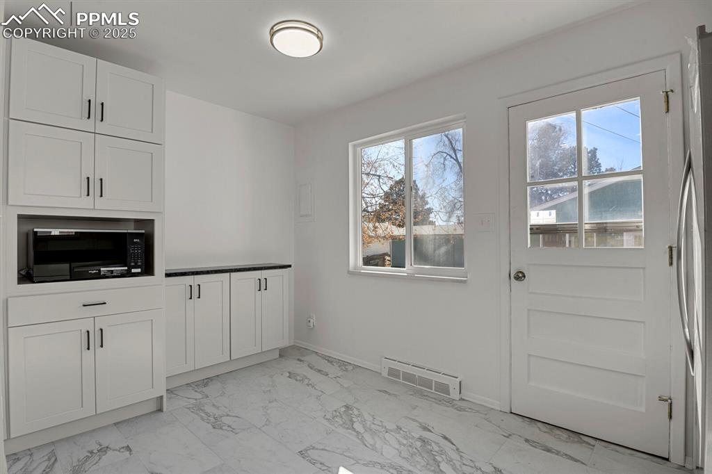 Image 13 of 37: New pantry and extra storage cabinets