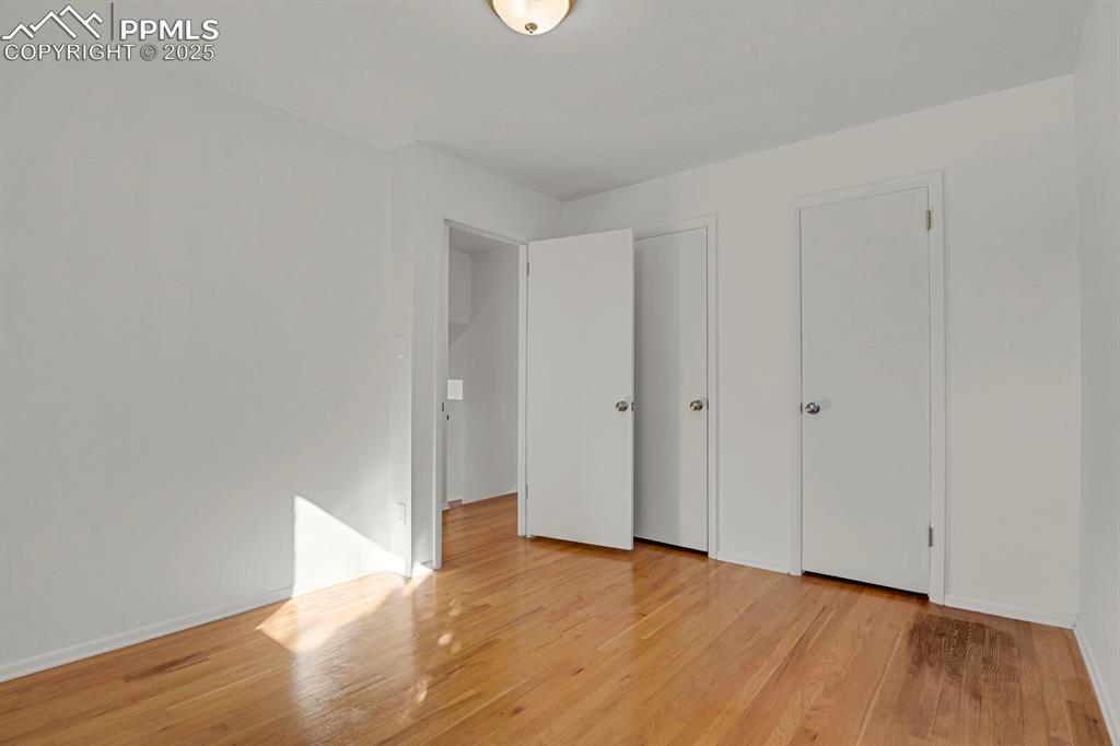Image 19 of 37: Double closets in second bedroom