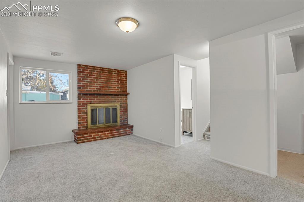 Image 22 of 37: Lower garden level family room with new carpet
