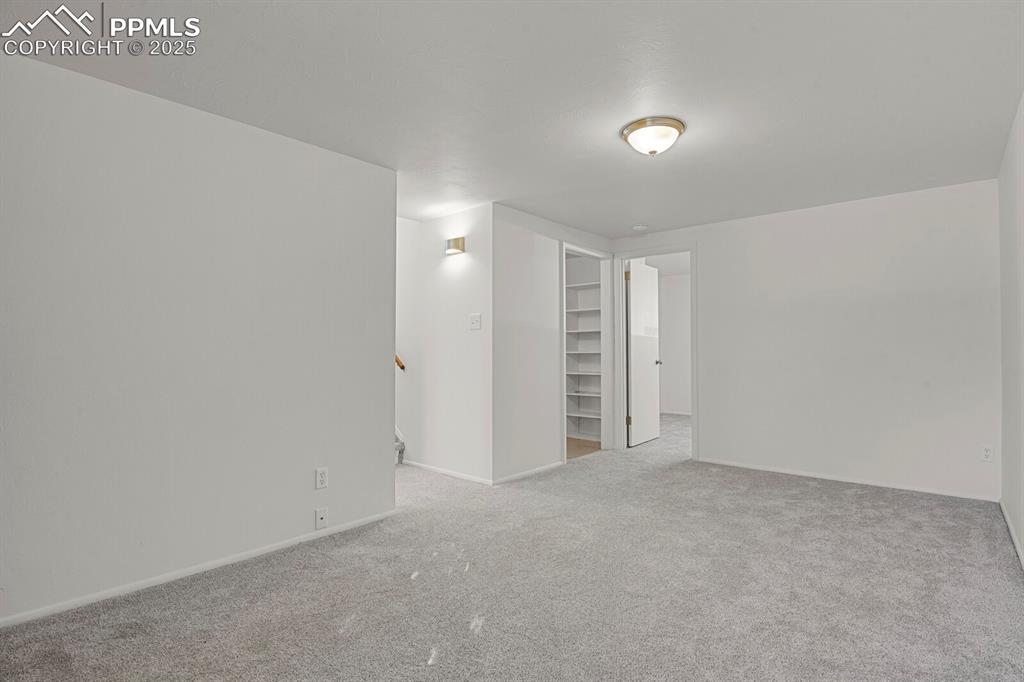 Image 23 of 37: New carpet and paint, access to the attached one car garage