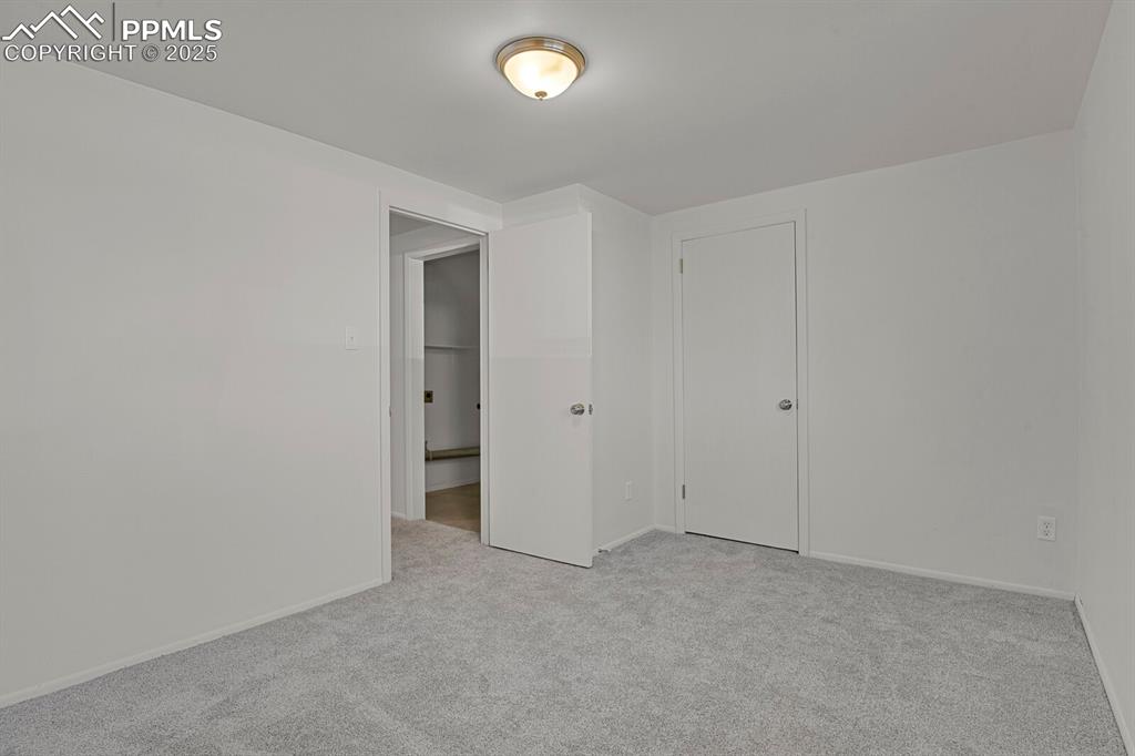 Image 26 of 37: New carpet in lower garden level bedroom