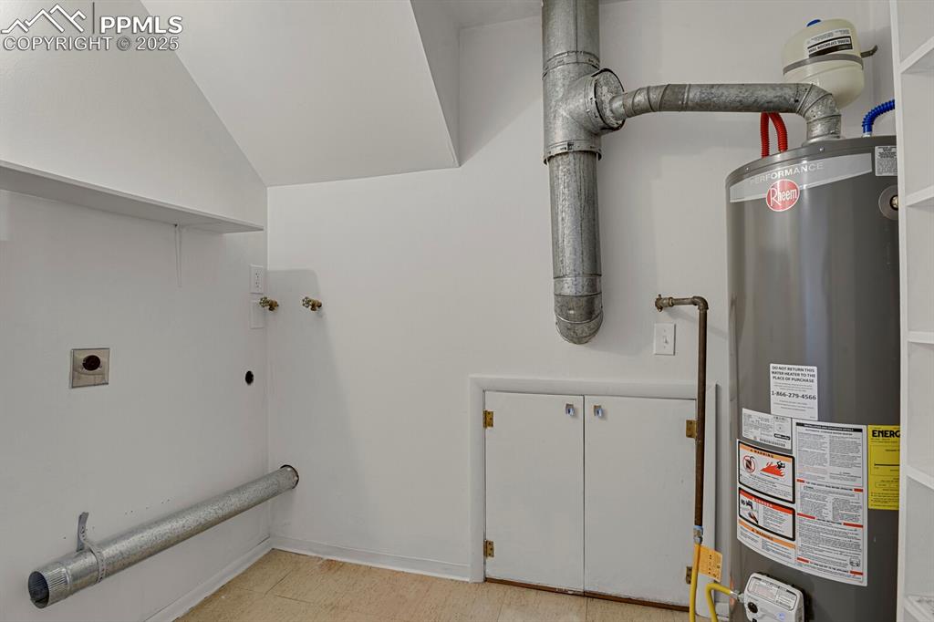 Image 27 of 37: New water heater in the lower level laundry room