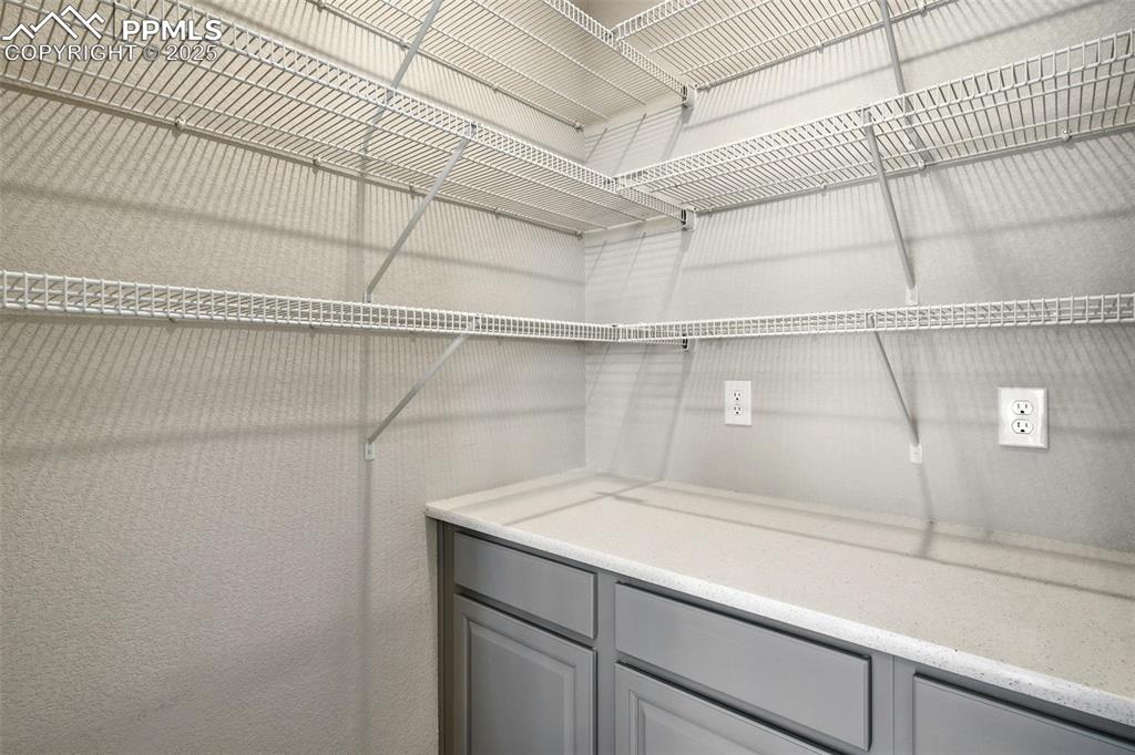 Image 15 of 50: Huge Pantry off the kitchen. Great for hiding the Coffee pot, toaster, toa