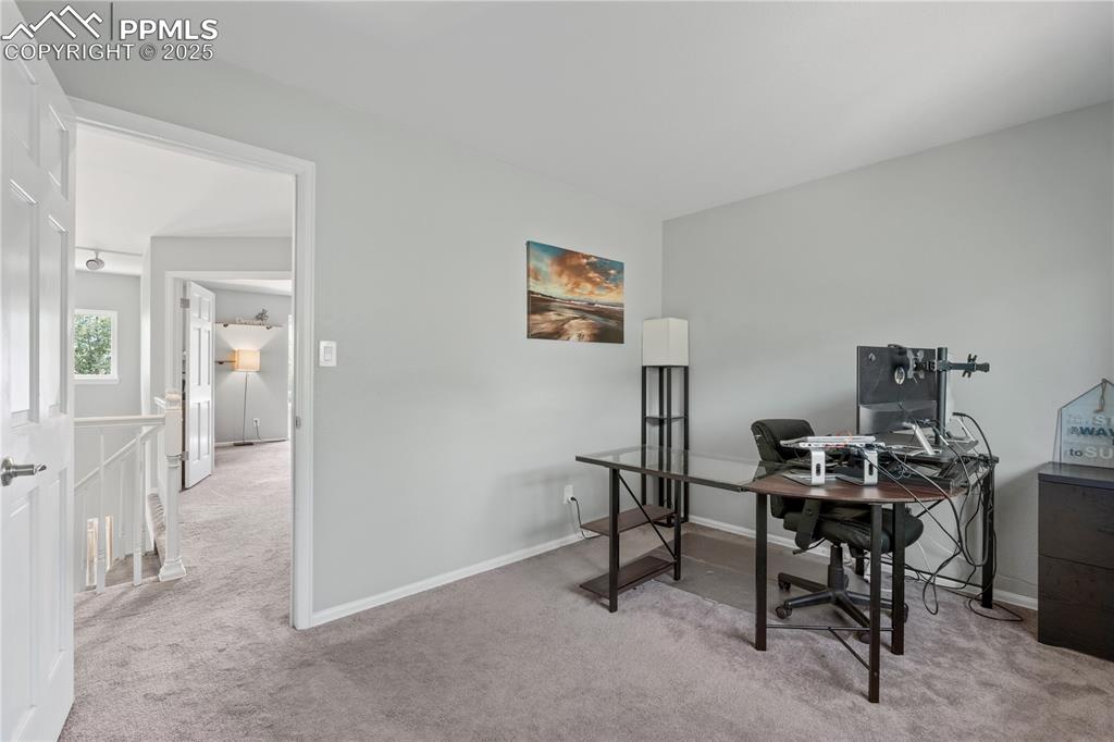 Image 29 of 50: Office space featuring carpet floors