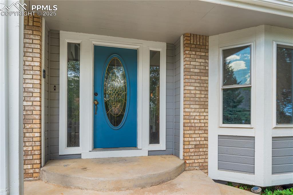 Image 3 of 50: Property entrance with covered porch
