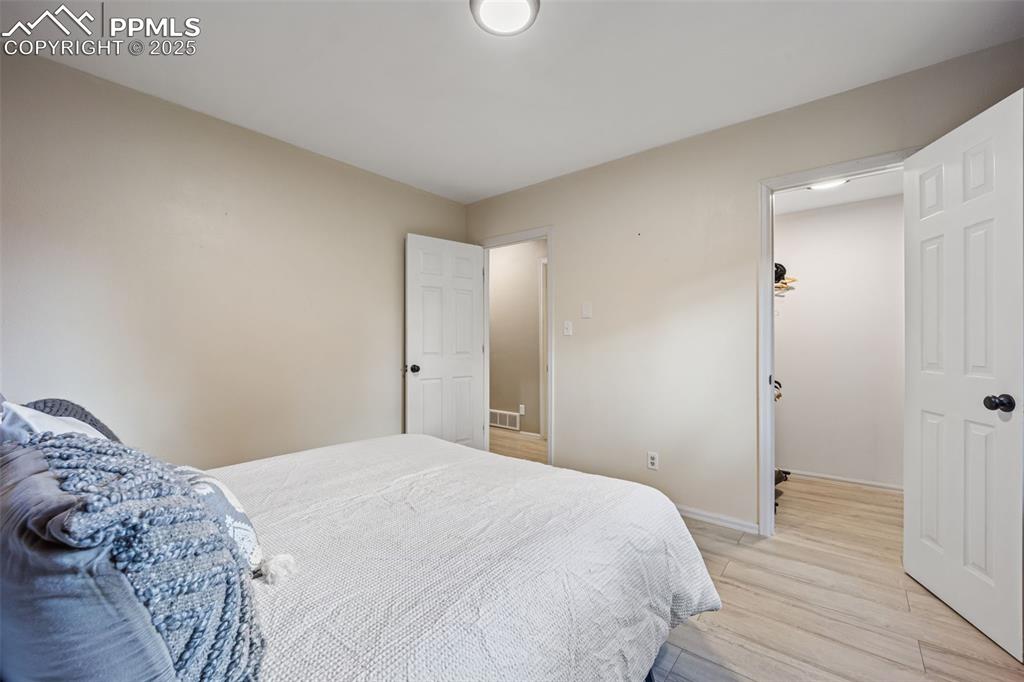 Image 15 of 48: Bedroom number 1 on main level with spacious closet