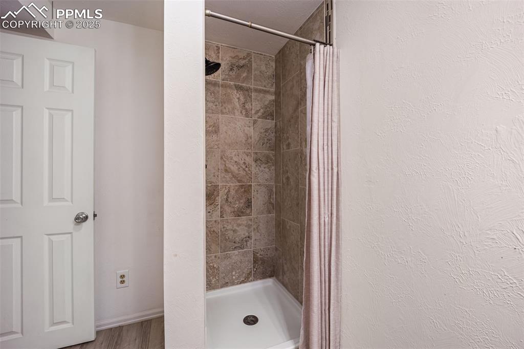 Image 27 of 48: 3/4 en-suite for Primary bedroom on the basement level