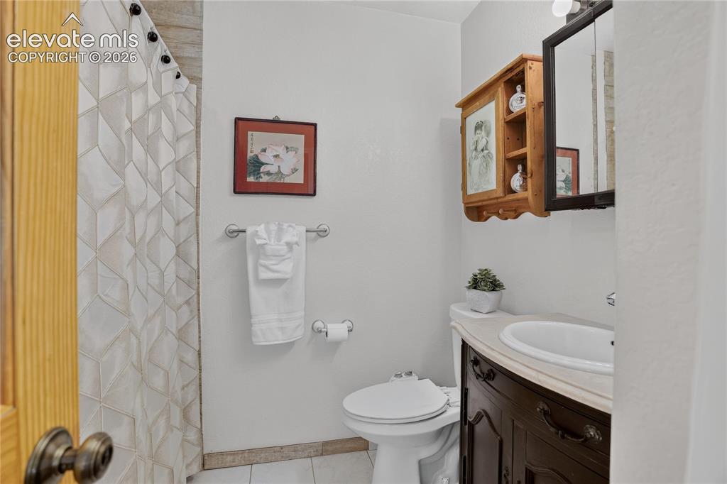 Image 12 of 25: Guest bath - upper level