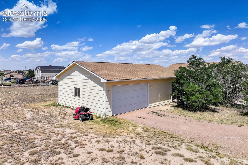 Image 19 of 25: Detached 2-car garage with bonus space
