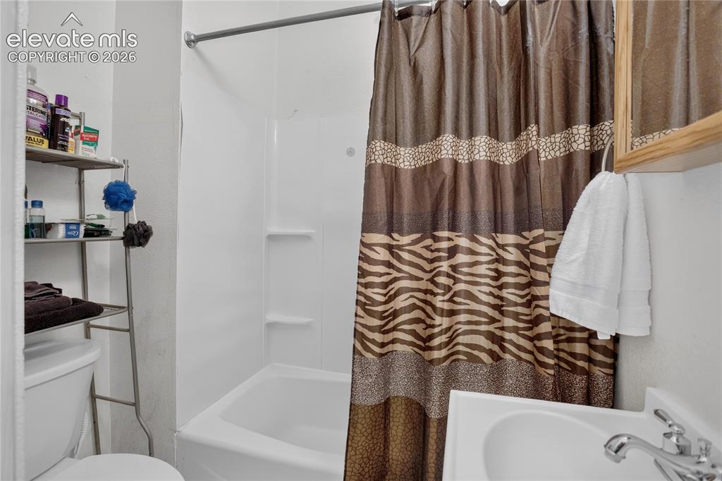 Image 22 of 25: Full guest bath in bonus space