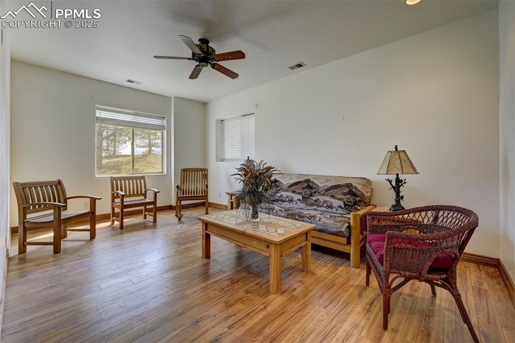 Image 22 of 50: Secondary bedroom in basement with ceramic tile flooring