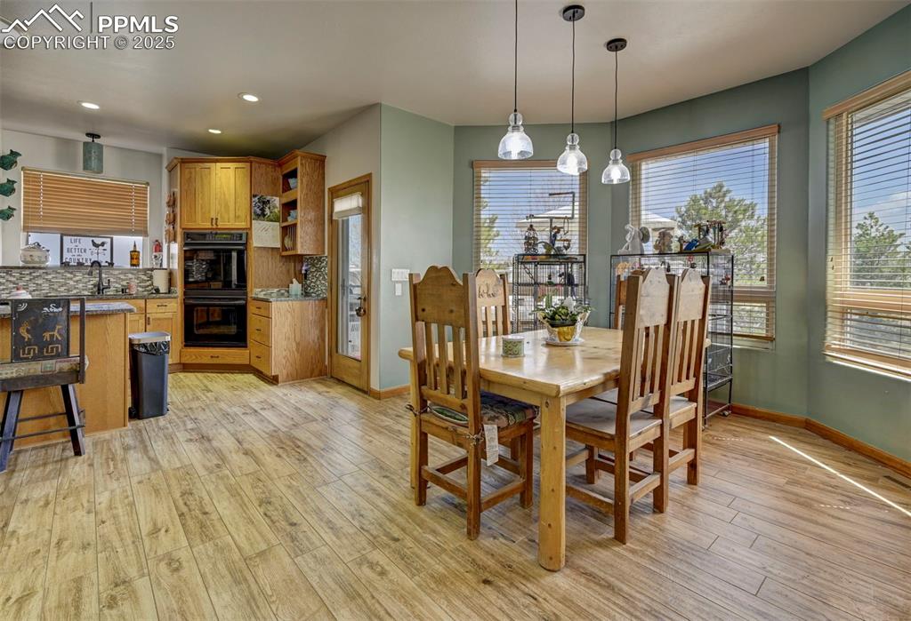 Image 7 of 50: Kitchen and dining area.