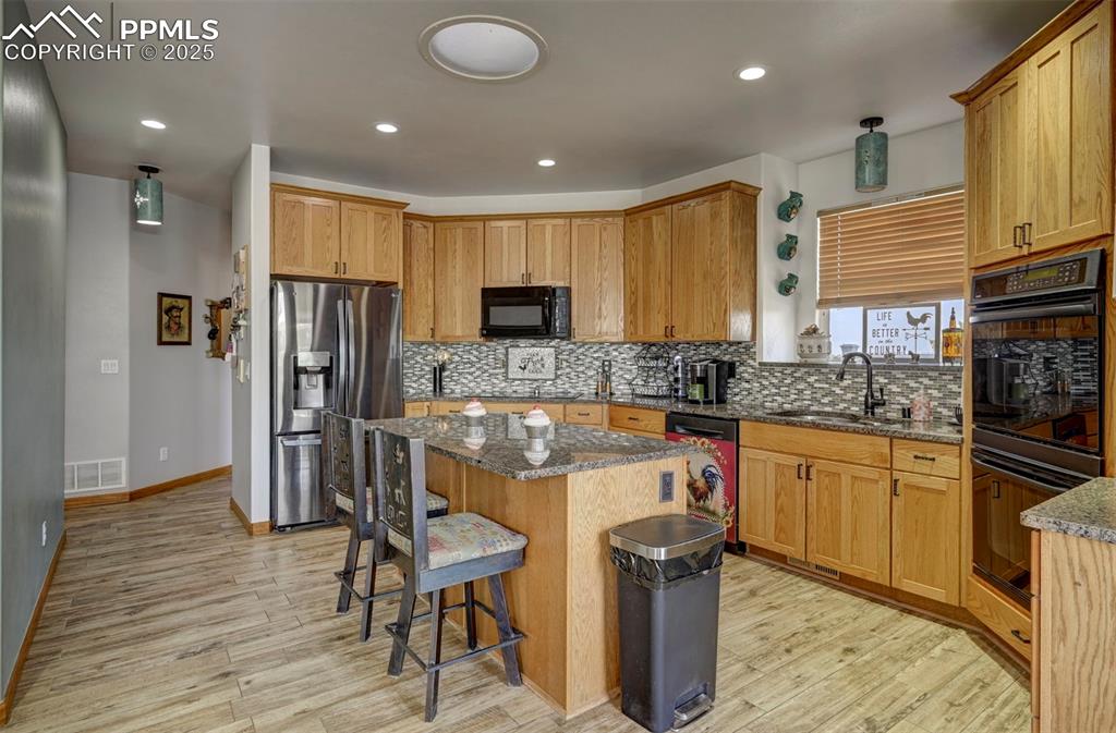 Image 9 of 50: Kitchen with ceramic tile flooring, granite counters, plenty of cabinet spa