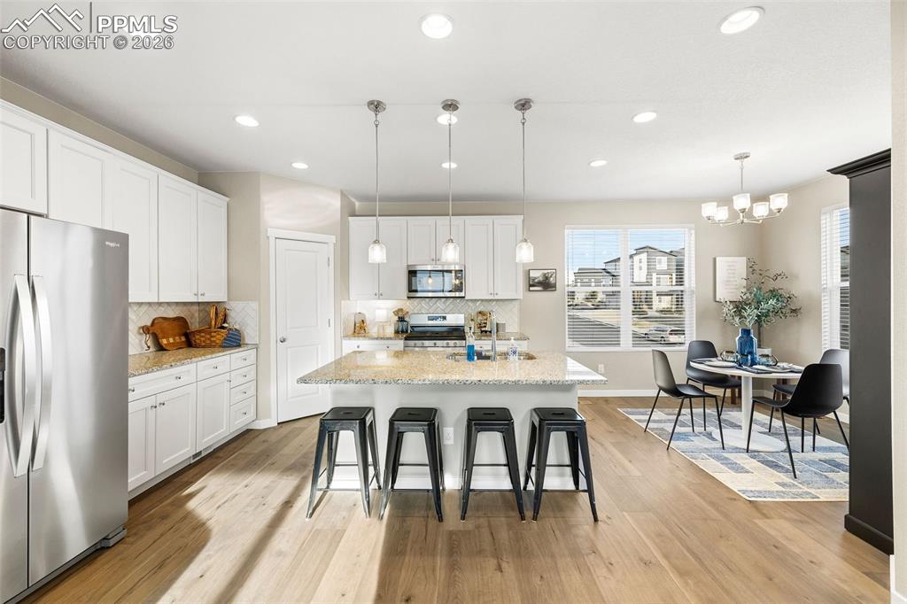 Image 10 of 33: The kitchen is truly a WOW space. Granite countertops, spacious island with