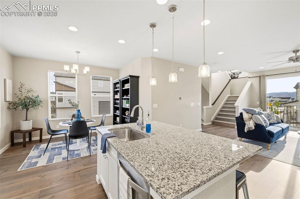 Image 12 of 37: The kitchen is open to the dining room and living area.