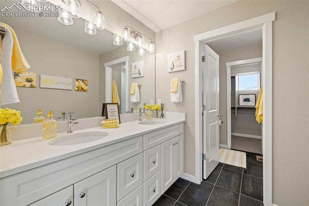 Image 18 of 33: Good morning! The ensuite primary bathroom is the perfect place to start yo