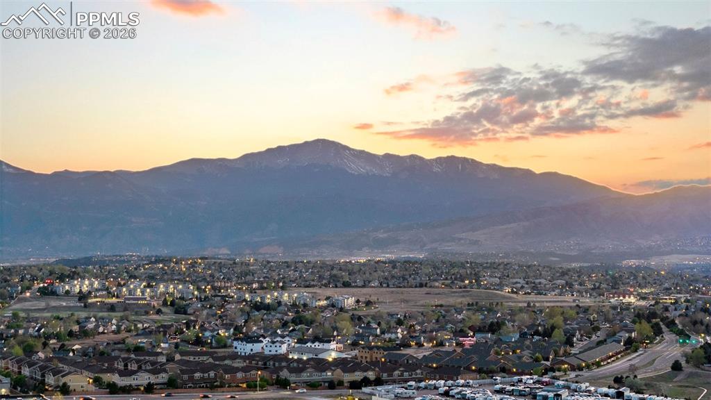 Image 2 of 37: Sunset views of Pikes Peak from the home.