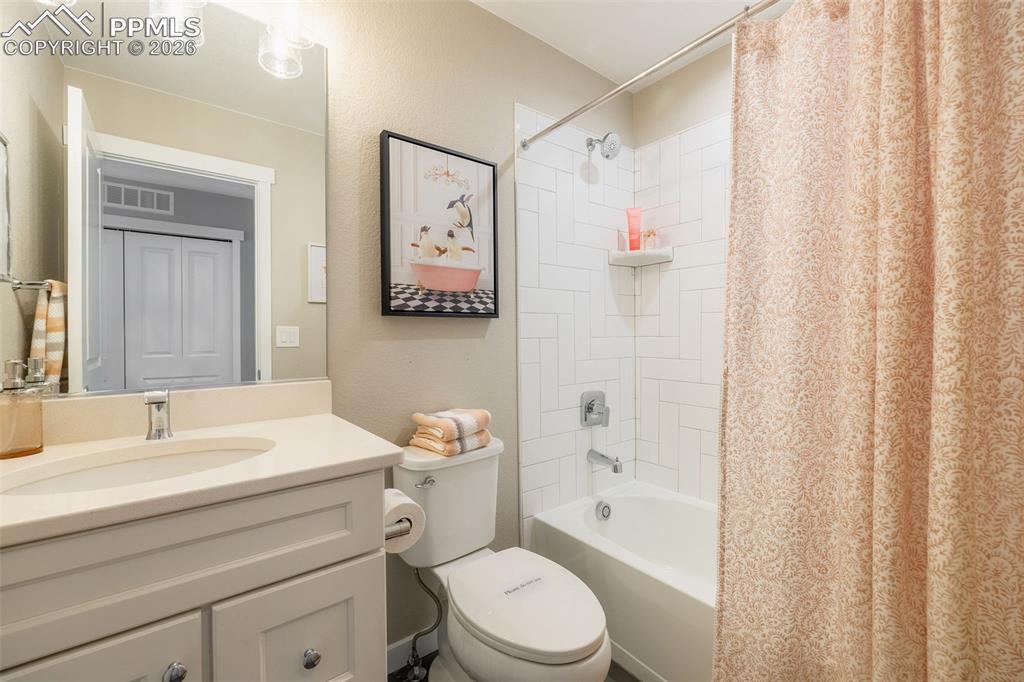 Image 22 of 33: The third bathroom in the home is adjacent to the second bedroom and featur