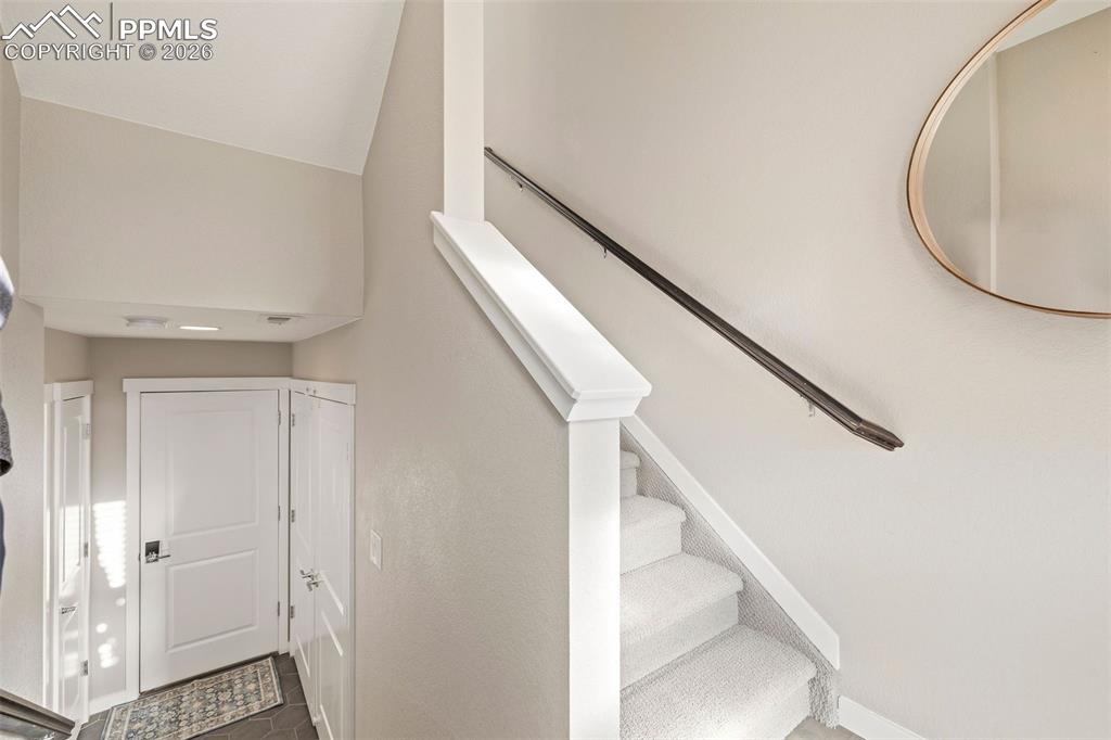 Image 25 of 33: The main entry has engineered wood flooring and room for guests to drop coa