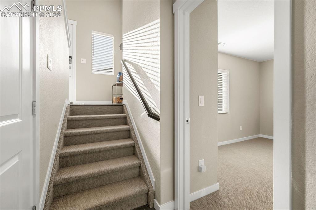 Image 26 of 33: Up the stairs is the main entry, as seen from the owner