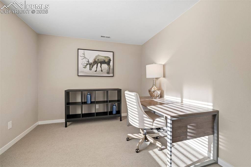 Image 27 of 33: This third bedroom has room for a queen-sized bed and furnishings, or you c