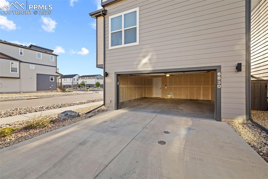 Image 29 of 33: The two-car garage is spacious and has an automatic door opener and outside