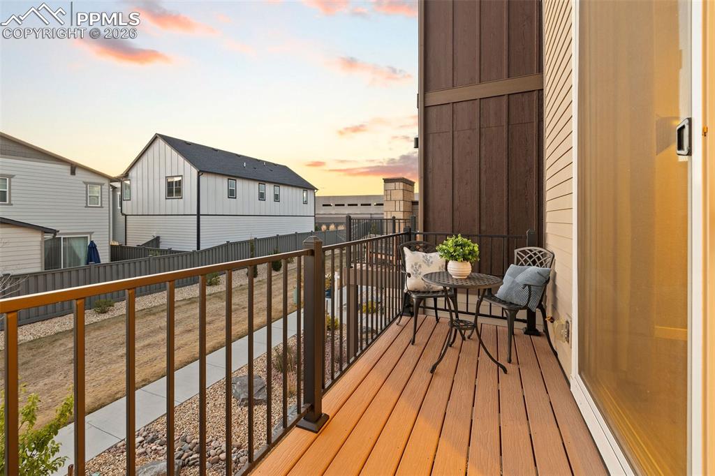 Image 8 of 33: Your balcony offers amazing sunset views, composite decking for low mainten