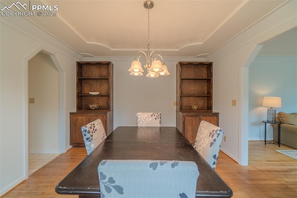 Image 10 of 48: Built in cabinets and tray ceiling