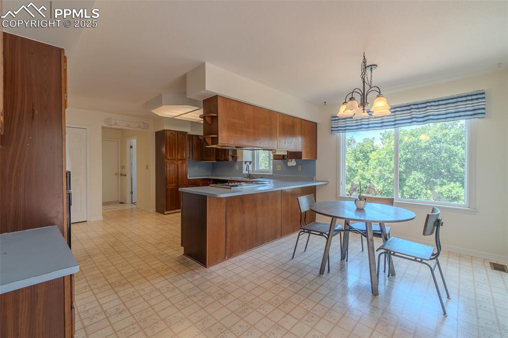 Image 11 of 48: Kitchen with eat in breakfast nook