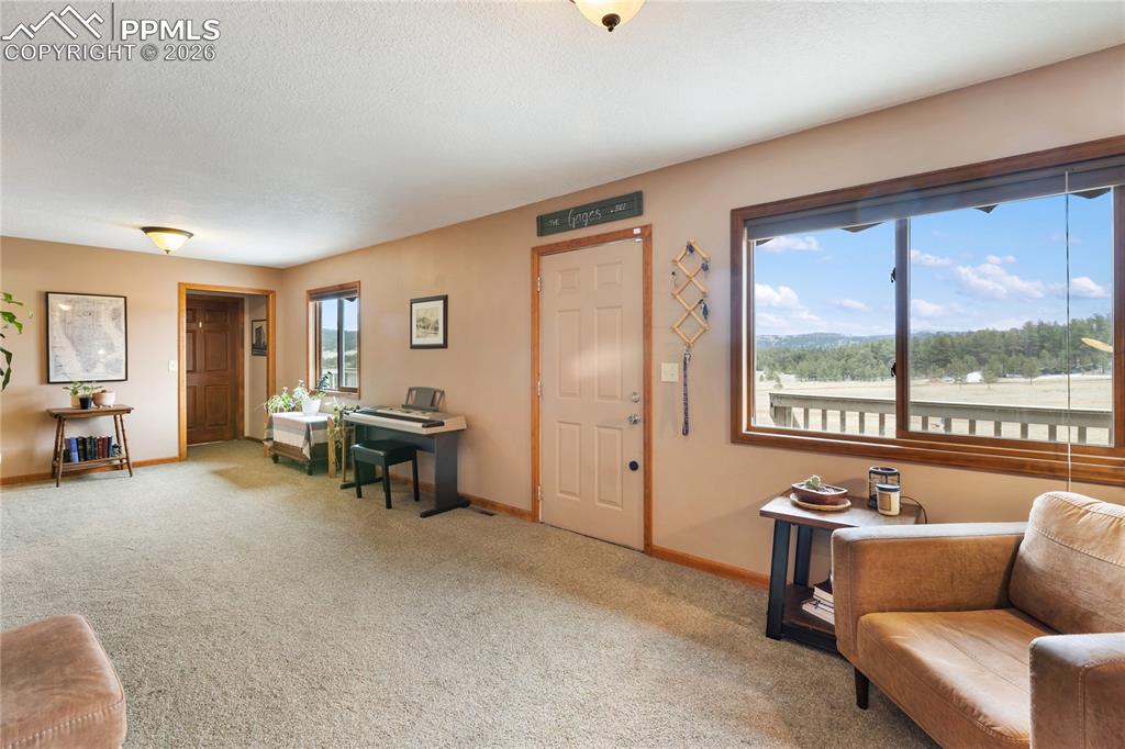 Image 16 of 42: The front entry opens into the sitting room!