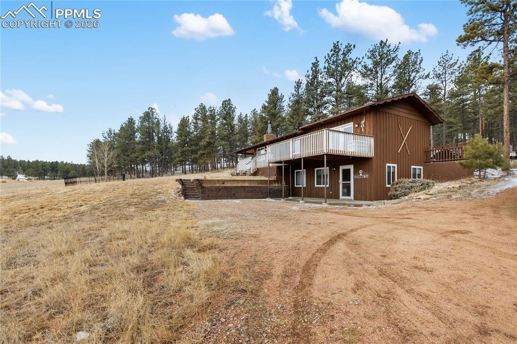 Image 2 of 42: The Side of the home and the driveway!