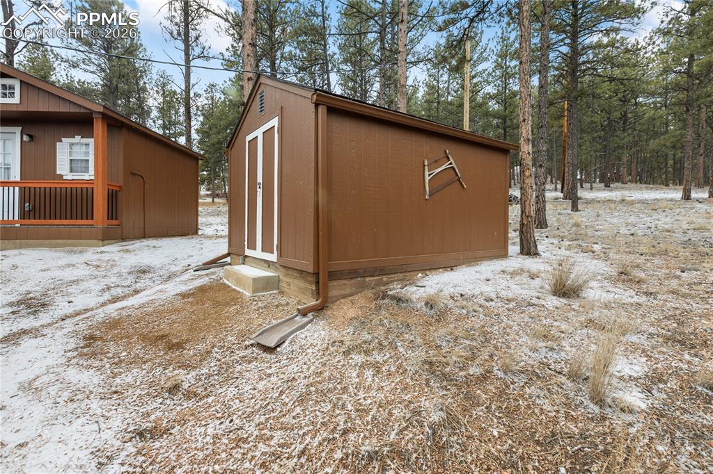 Image 25 of 42: The property also features an outdoor-access bunkhouse!