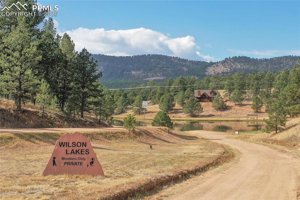 Image 34 of 42: The home has a private, stocked lake with community fishing access!