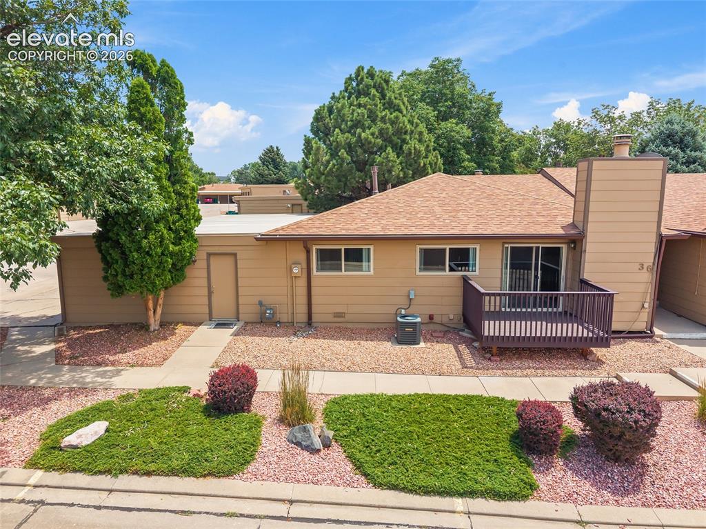 Image 1 of 26: Exterior featuring a private wooden deck, sliding glass door access, and a