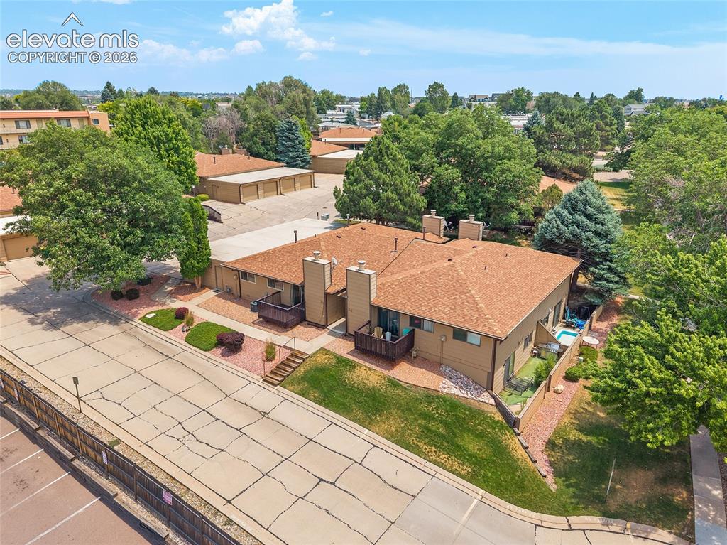 Image 26 of 26: Multi-unit residence featuring a private backyard with a hot tub and artifi