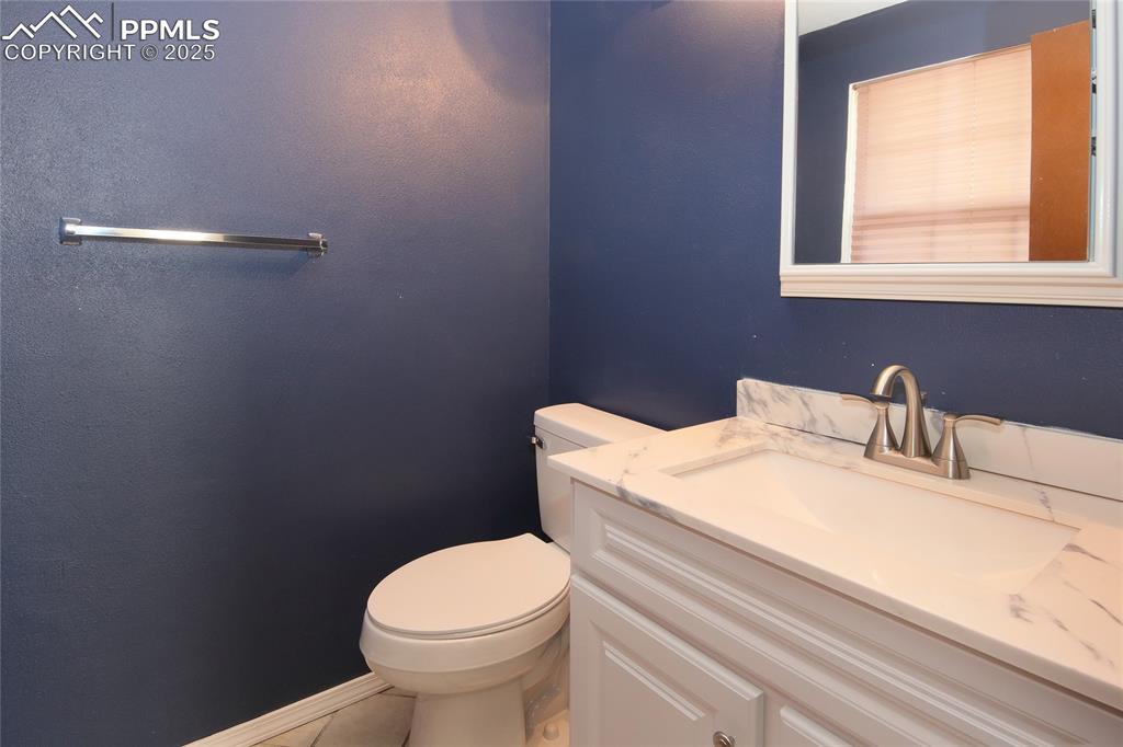 Image 13 of 33: Main level Half bathroom with vanity