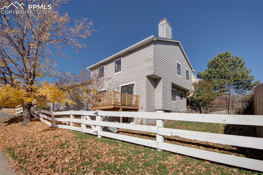 Image 31 of 33: View of property exterior featuring a fenced backyard and a chimney