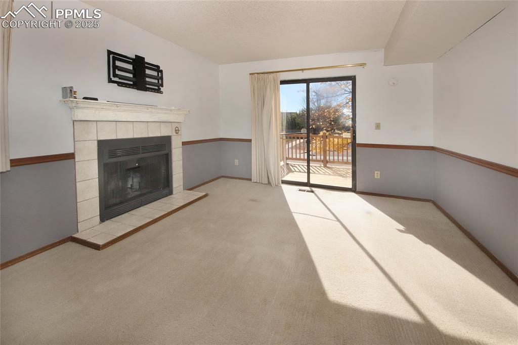 Image 4 of 33: Family Room with wood burning fireplace