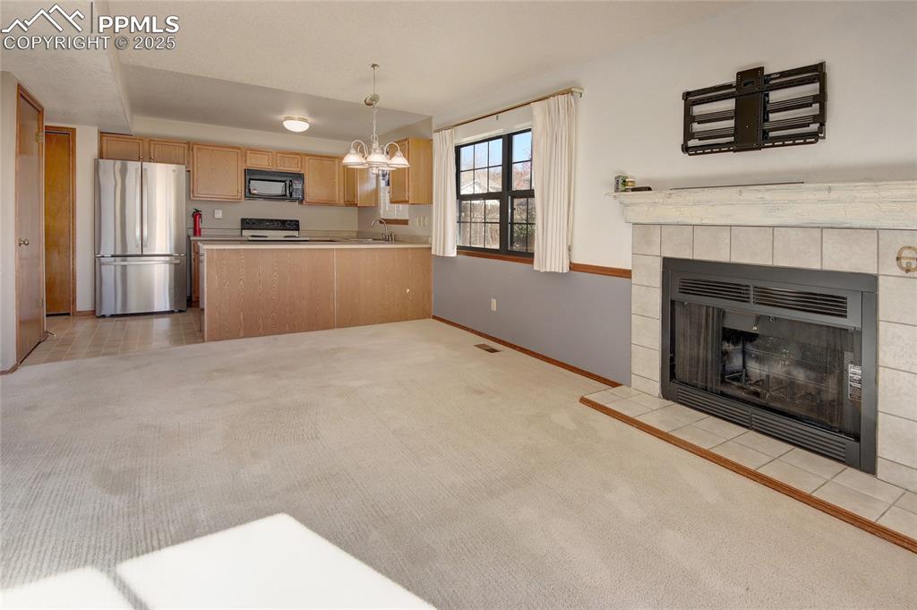 Image 5 of 33: View into the dining area and kitchen from the Family Room area