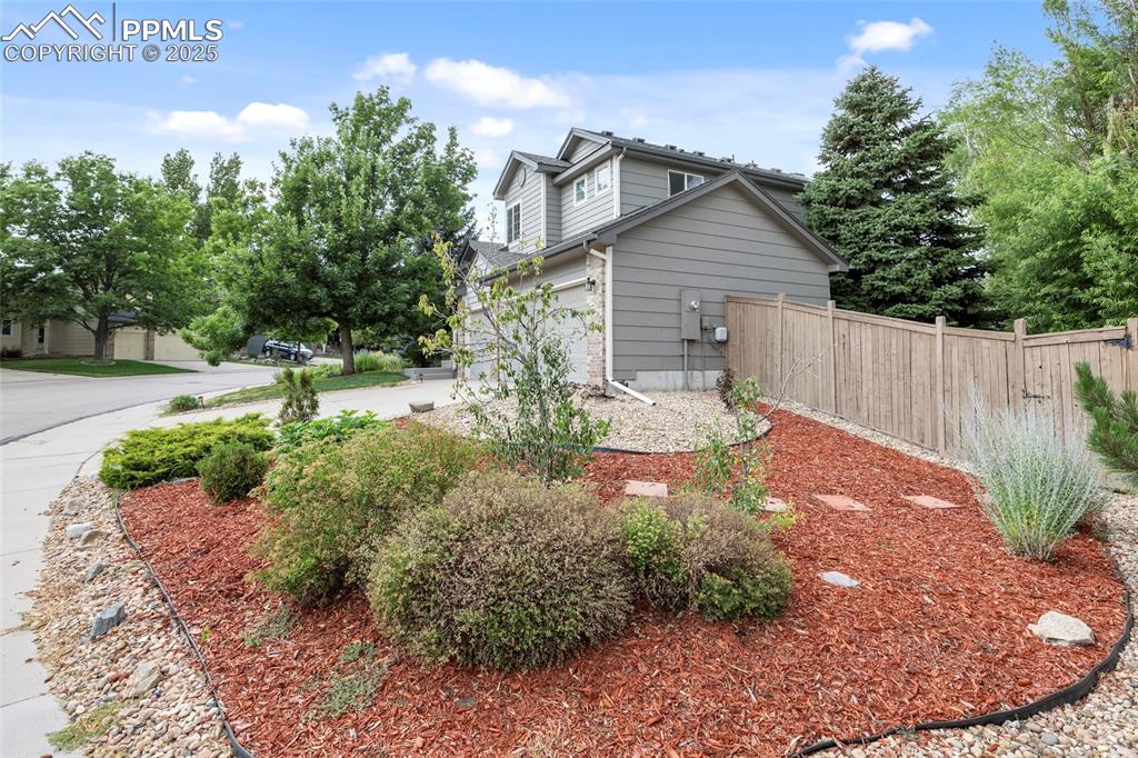 Image 6 of 50: View of yard featuring concrete driveway