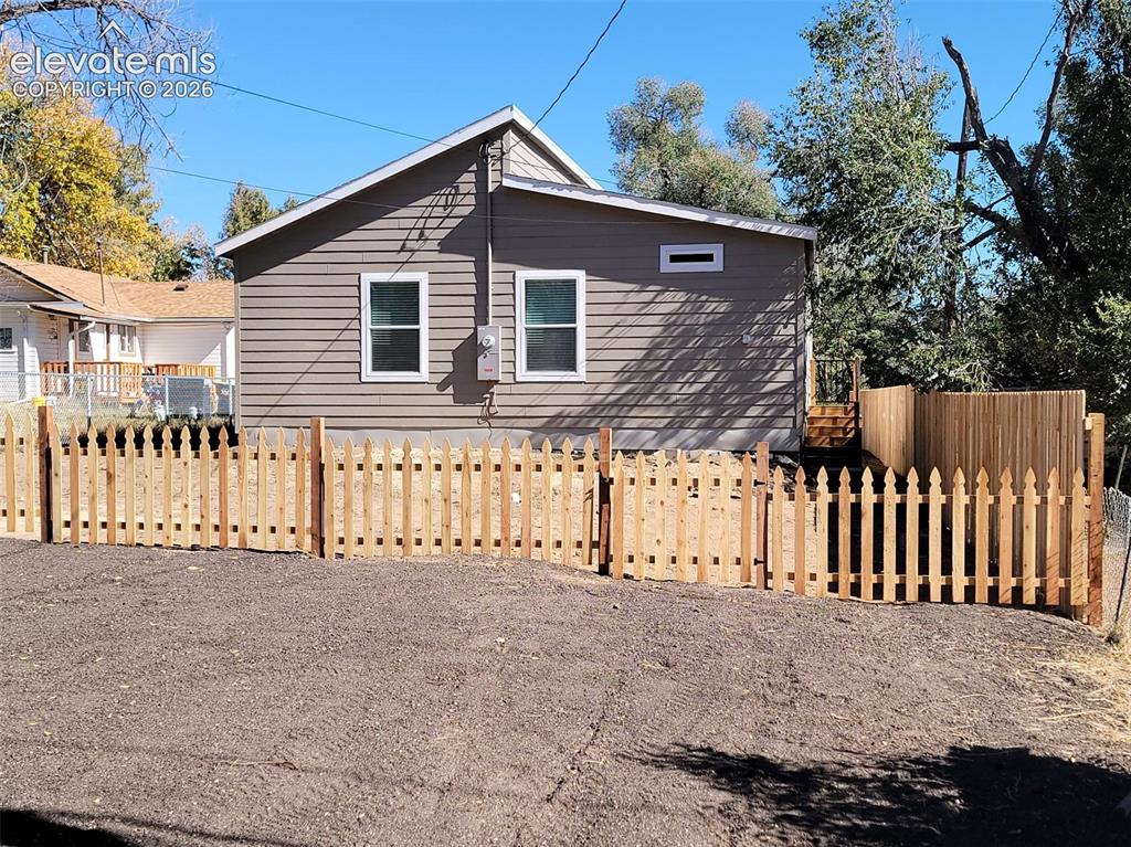 Image 41 of 41: Exterior featuring horizontal lap siding, a gabled roofline, double-hung wi