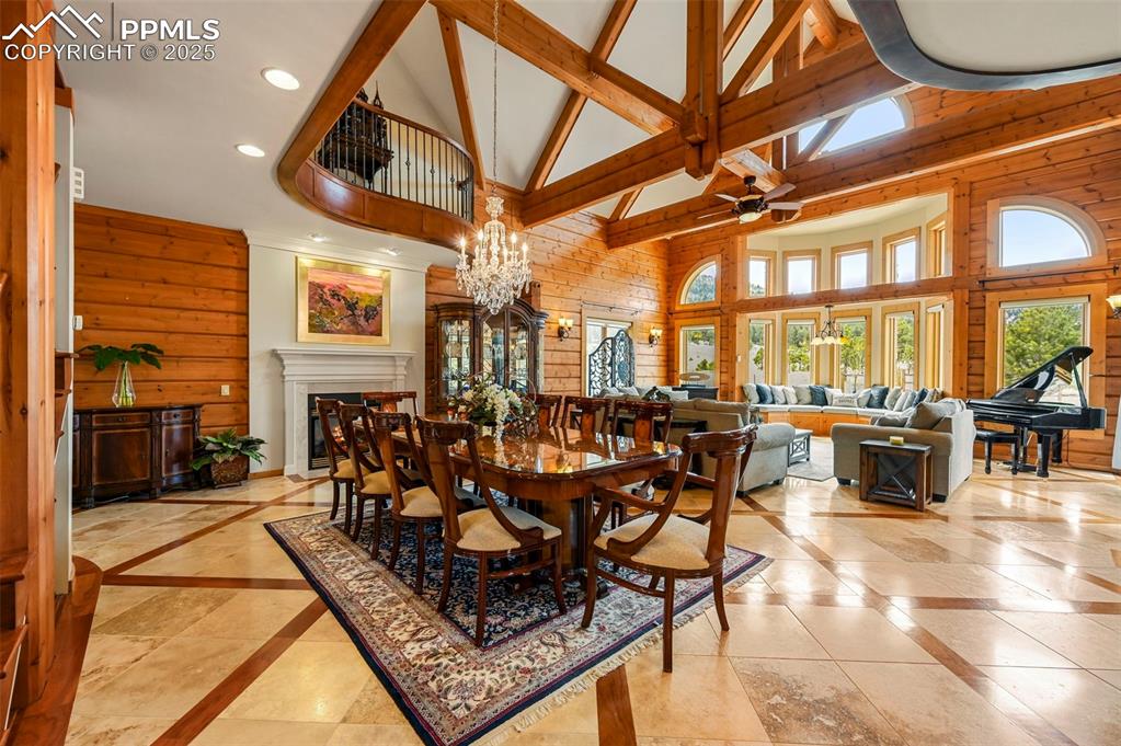 Image 18 of 50: Dining room featuring recessed lighting, beam ceilings and chandelier