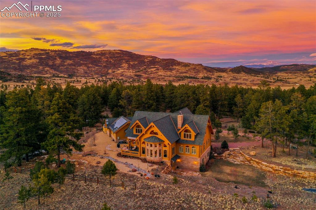 Image 2 of 50: Aerial view at dusk and a mountain view