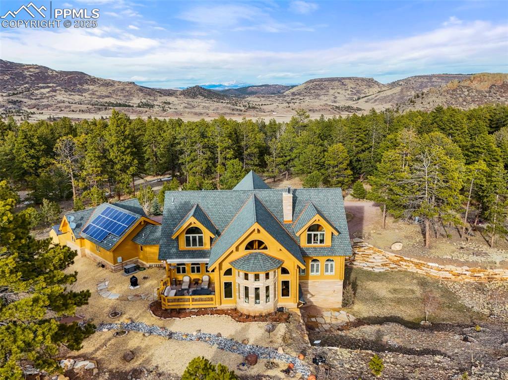 Image 40 of 50: Drone / aerial view with a wooded view and Mountain View