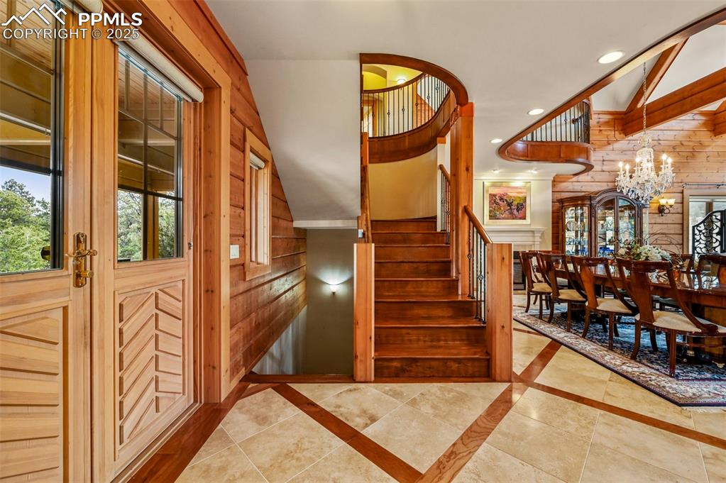 Image 6 of 50: Front door entryway, foyer and staircase