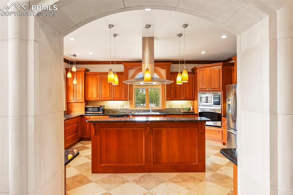 Image 9 of 50: Kitchen featuring a center island