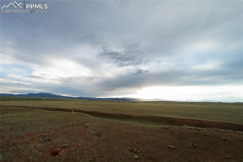 Image 10 of 10: View of mountain backdrop featuring rural landscape